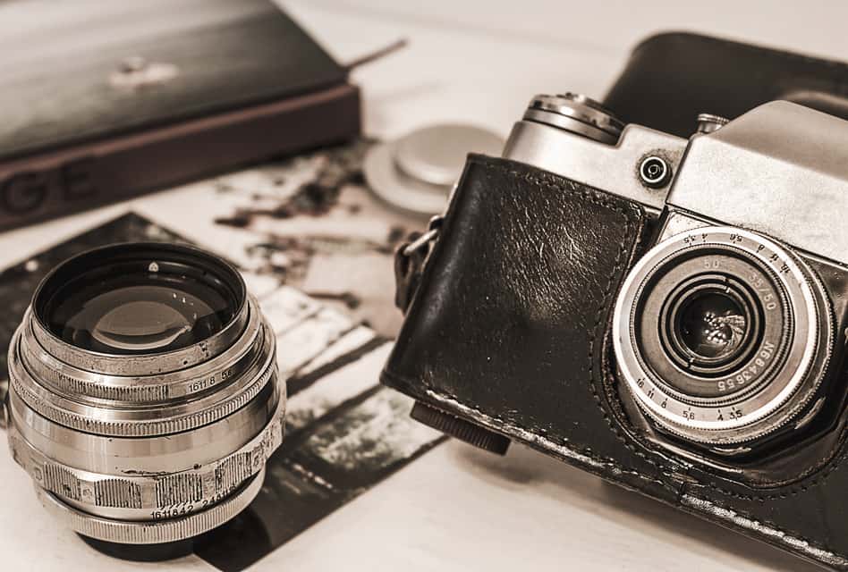 The Genealogy Blog Party celebrates National Photography Month 2021; old camera, lens, and photos