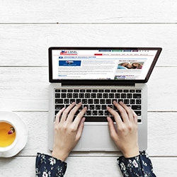 Lectures 11 Image of a woman's hands on a laptop computer with the DAR website on the screen.