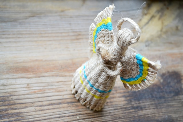 Review - Genealogy at a Glance: Ukrainian Genealogy Research 2 Image of a traditional faceless Ukrainian motanka doll with a halo and wings.