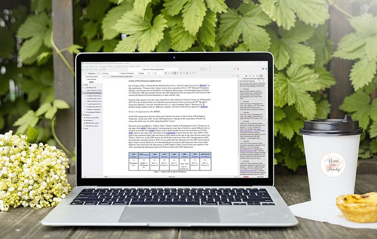 A laptop computer with Scrivener software on the screen sitting on a wood table in front of green leaves and a to-go cup of coffee and pastry sitting on the right.