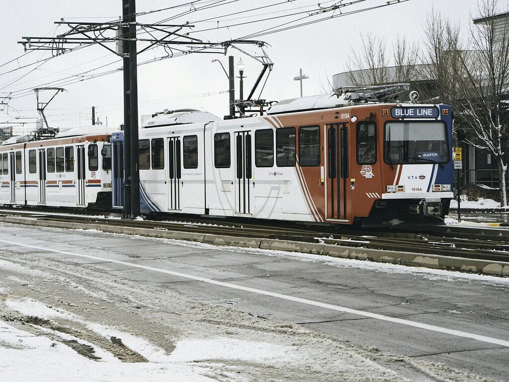 How to Prepare for RootsTech: A Practical Guide 4 Salt Lake City's TRAX light rail train on a snowy winter day, showcasing urban public transport.