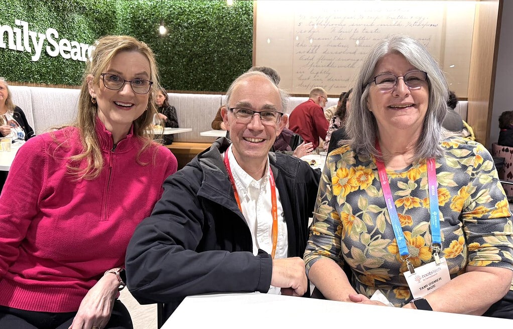 What to Do After RootsTech: Turn Conference Inspiration into Genealogy Progress 3 Three people at a conference table.
