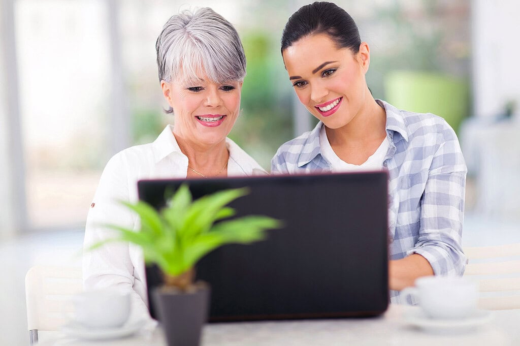 Before You Take a DNA Test for Genealogy: A Beginner's Guide 3 Senior mother and daughter using laptop computer
